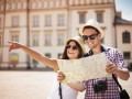 Happy tourist sightseeing city with map